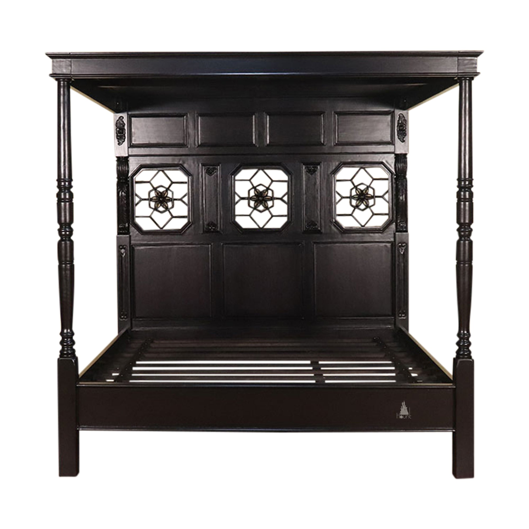 Side view of the Alchemist Bed showing the substantial timber frame, high headboard and grounded footboard structure