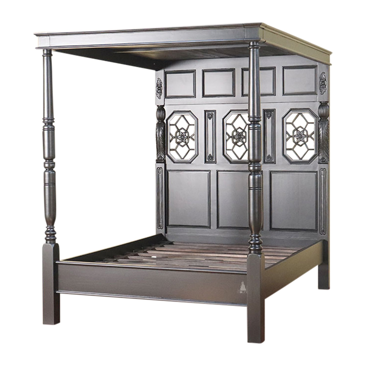 Detail view of the Alchemist Bed showing dark carved mahogany construction and gothic timber shaping