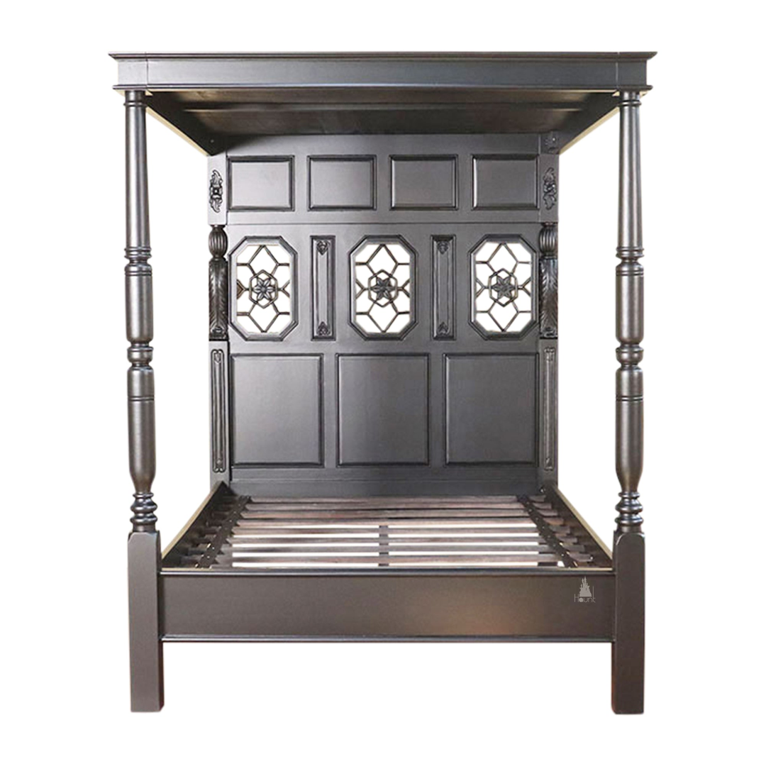 Alchemist Bed shown in a dark luxury bedroom setting with a solid carved frame and restrained gothic form