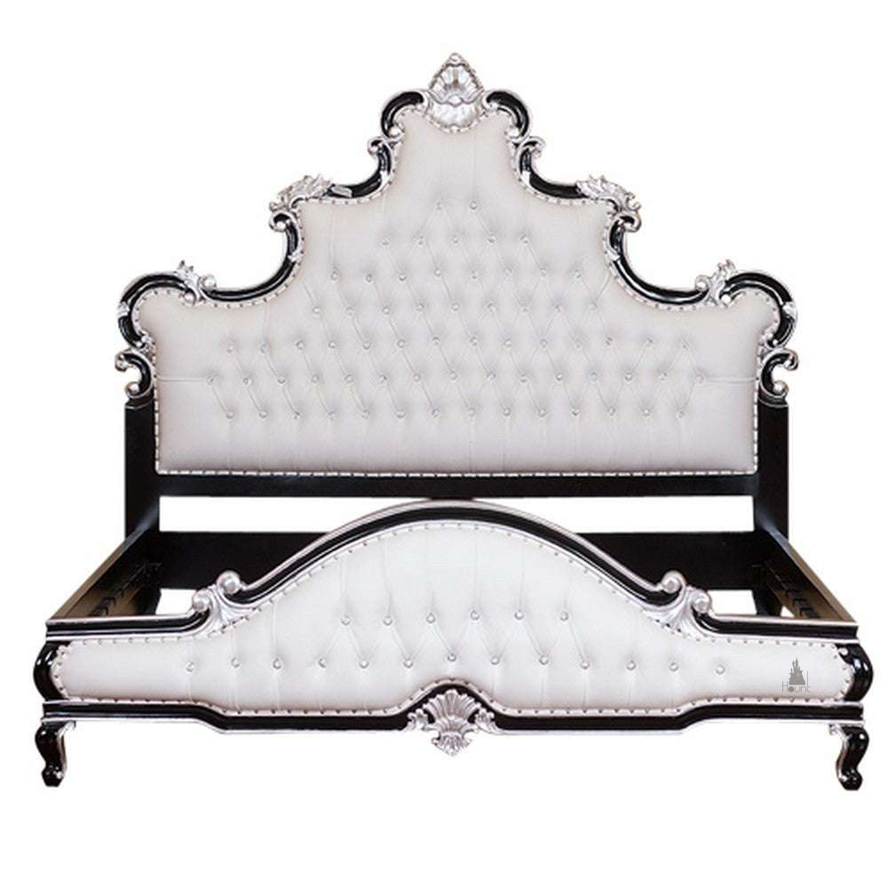 Aphrodite Bed shown at an angle with carved gothic headboard, upholstered detailing and sculptural footboard