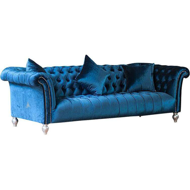 The Aphrodite Chesterfield Lounge, a handcrafted three-seater chesterfield sofa with deep button-tufted upholstery and scrolled arms.