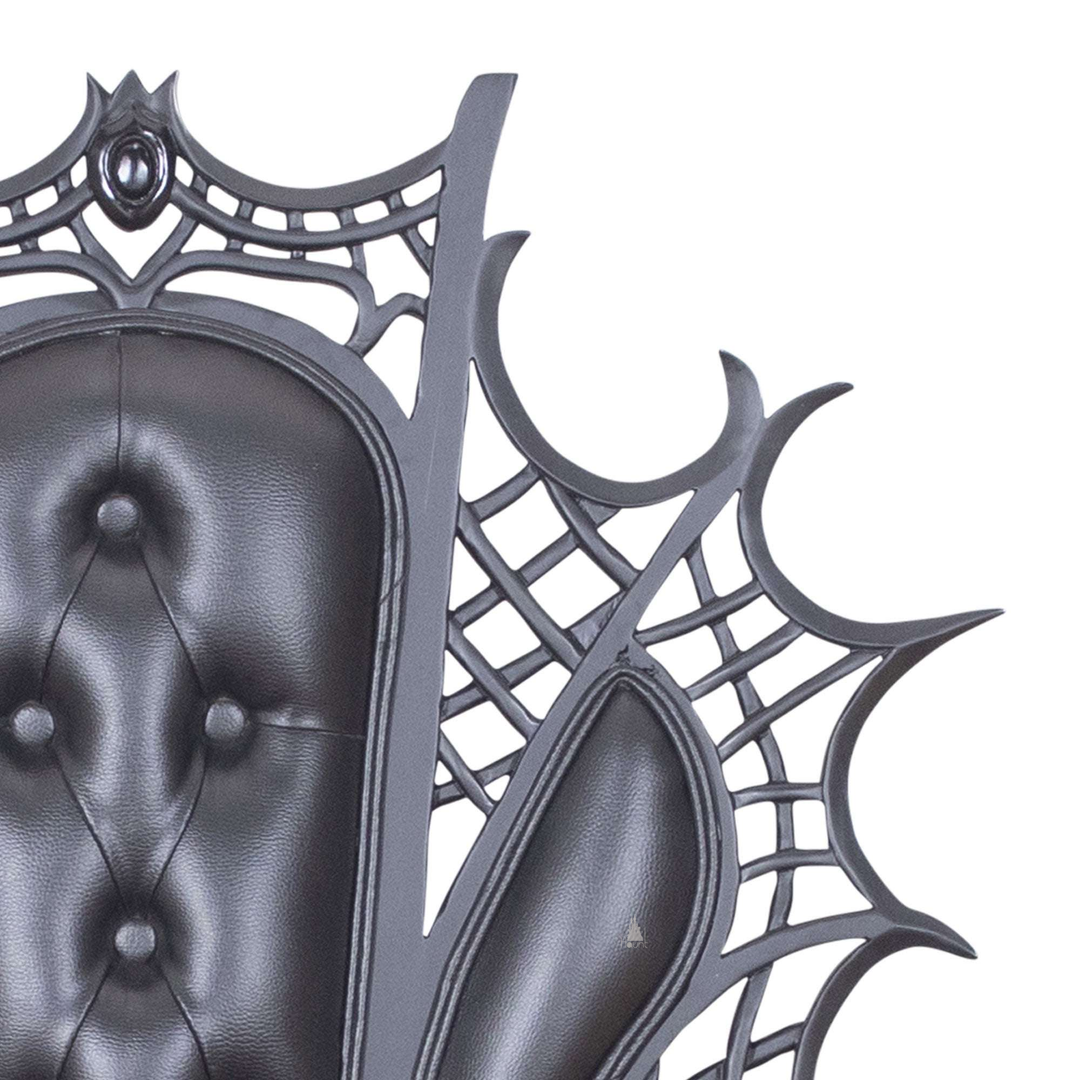 Another view of the Arachnid Throne, a black spider-inspired throne with a carved web back and sculpted legs