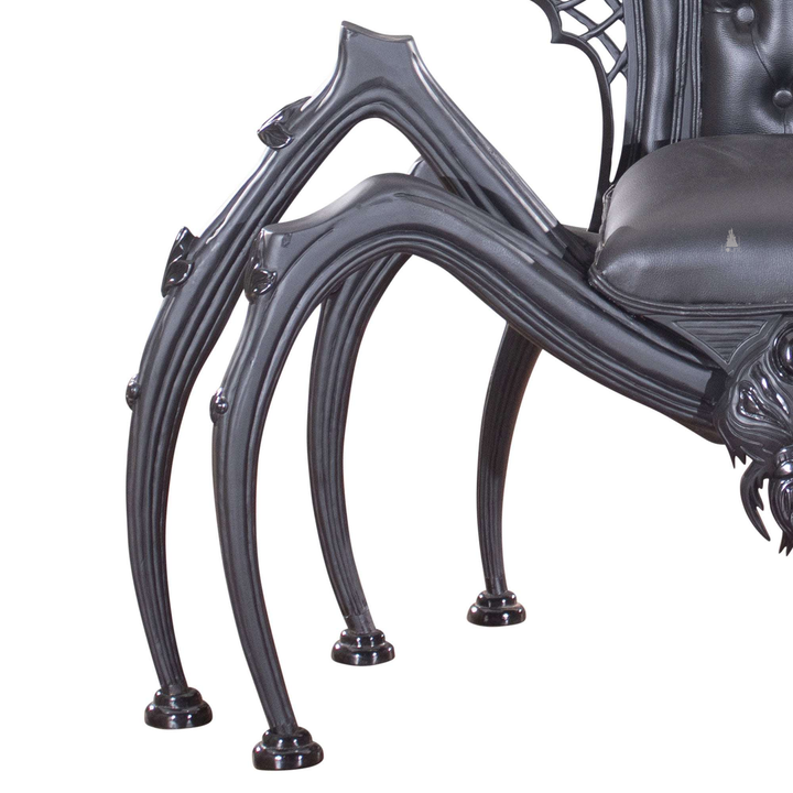 Another view of the Arachnid Throne, a black spider-inspired throne with a carved web back and sculpted legs