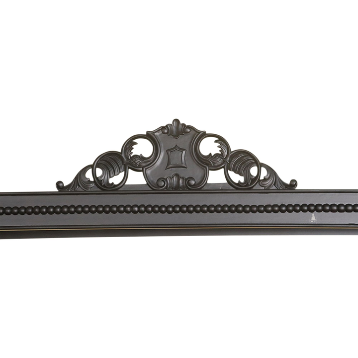 Detail view of the Aurora Bed showing ornate timber carving and semi-canopy bed construction