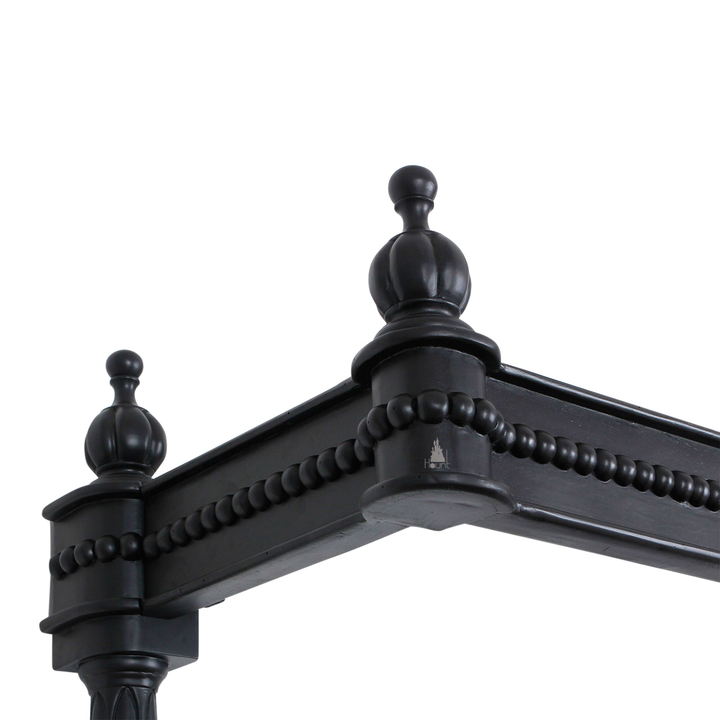 Aurora Bed close-up showing carved mahogany frame detail and handcrafted gothic finish