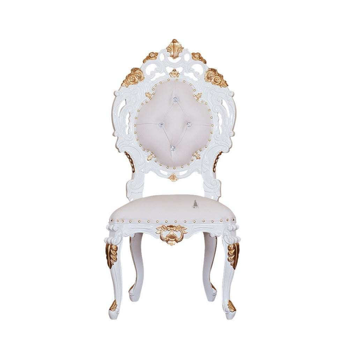 The Aurora Chair, a handcrafted ornate gothic chair with a high carved frame, upholstered seat and button-tufted back.