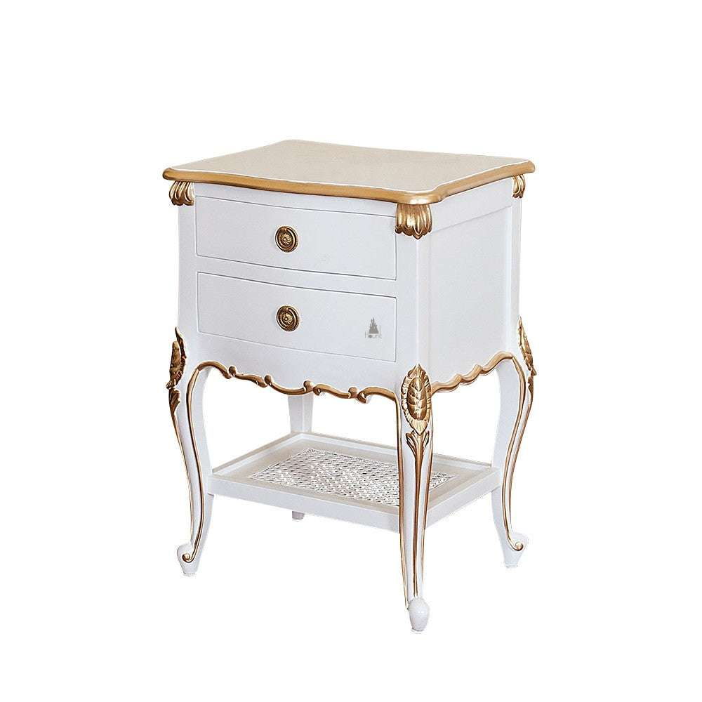 The Cinderella Side Table, a handcrafted white and gold side table with two drawers, a lower cane shelf and slender curved legs.