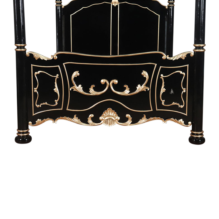The Countess Bed, a handcrafted four poster bed with slender posts, a shaped panel headboard and an ornate scrolled footboard.