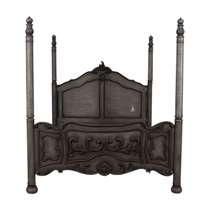 The Countess Bed, a handcrafted four poster bed with slender posts, a shaped panel headboard and an ornate scrolled footboard.