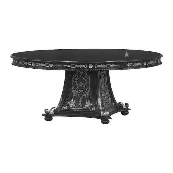 The Countess Dining Table, a handcrafted round gothic dining table with a broad top, decorative apron and statement pedestal base.