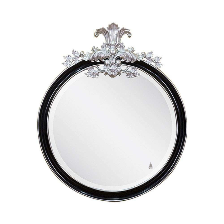 Countess Mirror, a round wall mirror with a bold circular frame and a decorative carved crest rising above the glass