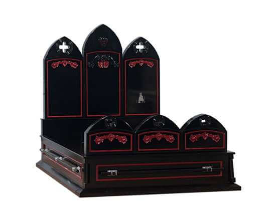 The Crypt Keeper Casket Bed, a handcrafted coffin-inspired gothic bed with arched headboard panels, red trim and cross details.