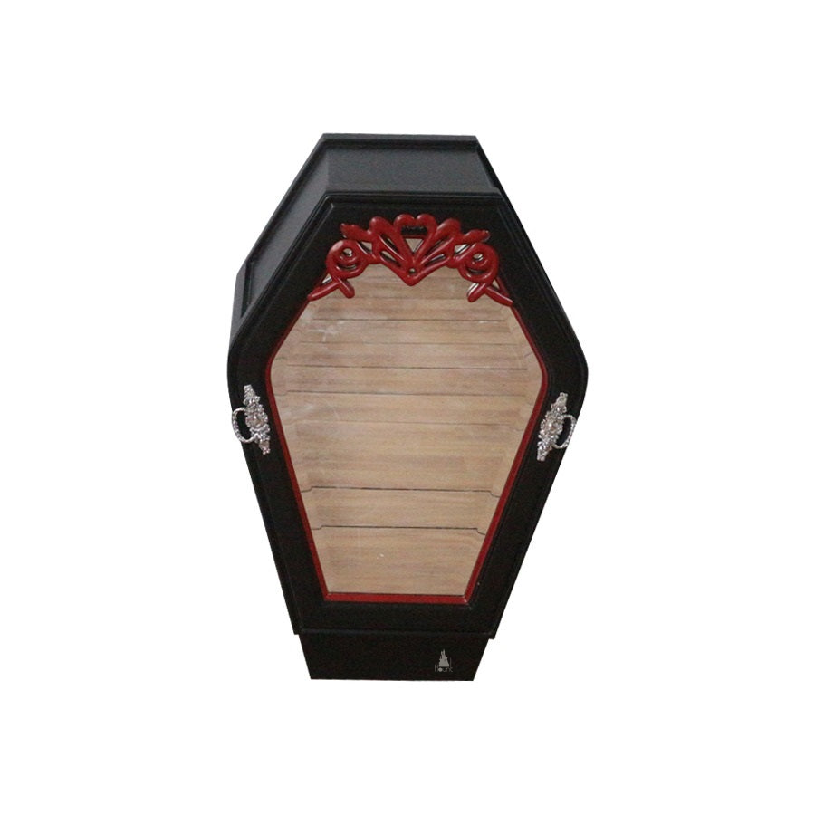 The Crypt Keeper Side Table, a handcrafted coffin-shaped bedside cabinet with framed front panel, carved crest detail and integrated drawer storage.