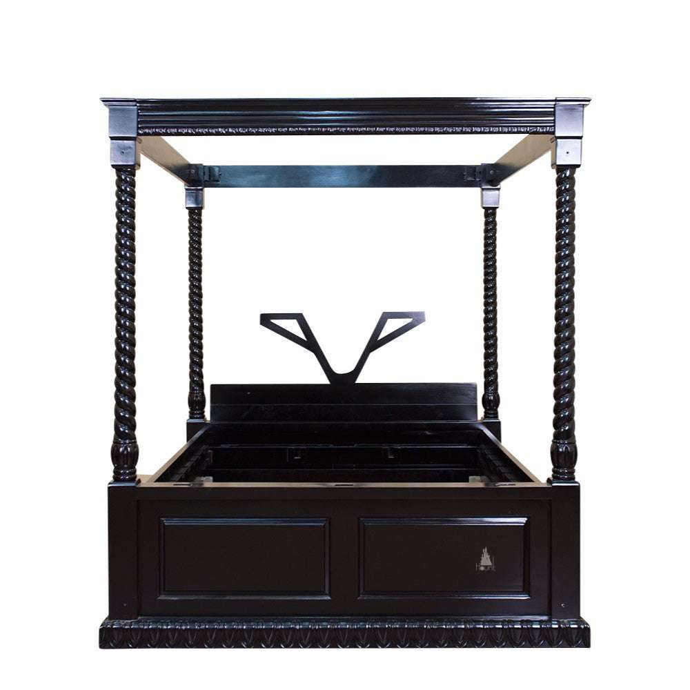 The Dark Desires Stirrups Bed, a BDSM-inspired handcrafted four poster bed with barley-twist posts, tester frame and stirrup-style headboard detail.