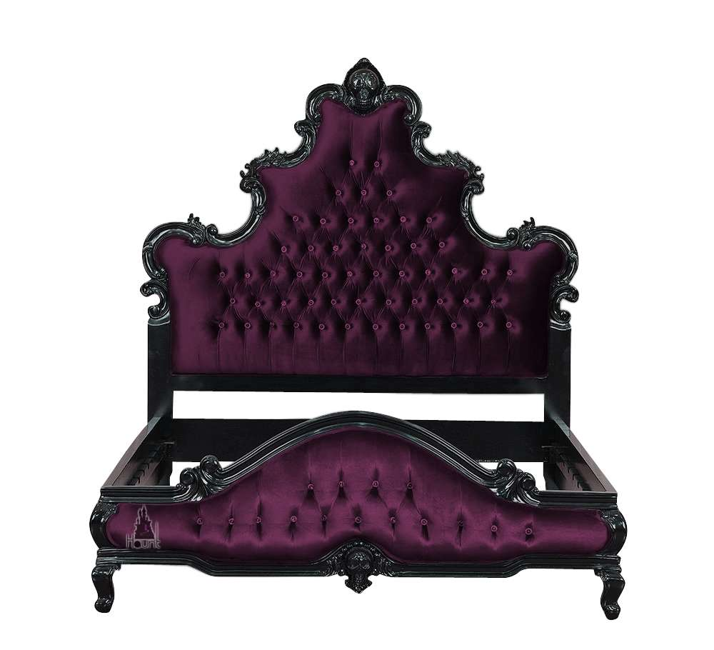 The Death Aphrodite Bed, a handcrafted upholstered gothic bed with a tall shaped headboard, curved footboard and a carved skull crest.