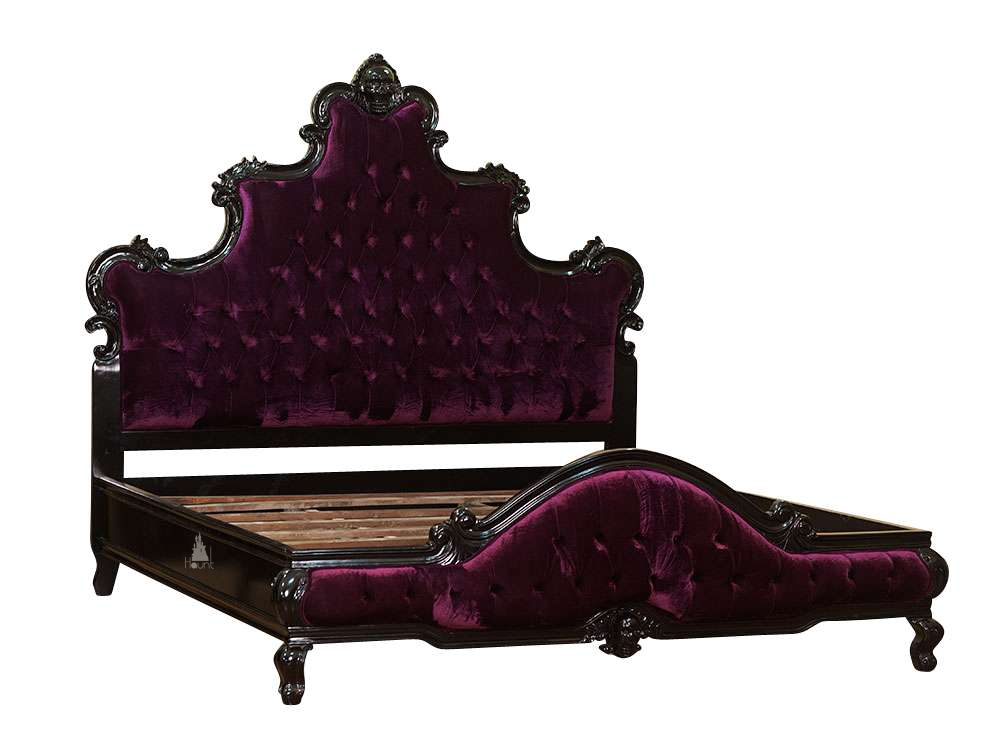 The Death Aphrodite Bed, a handcrafted upholstered gothic bed with a tall shaped headboard, curved footboard and a carved skull crest.