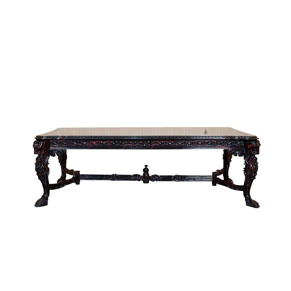 The Death Emperor Dining Table, a handcrafted black gothic dining table with carved legs, stretcher supports and skull detailing.