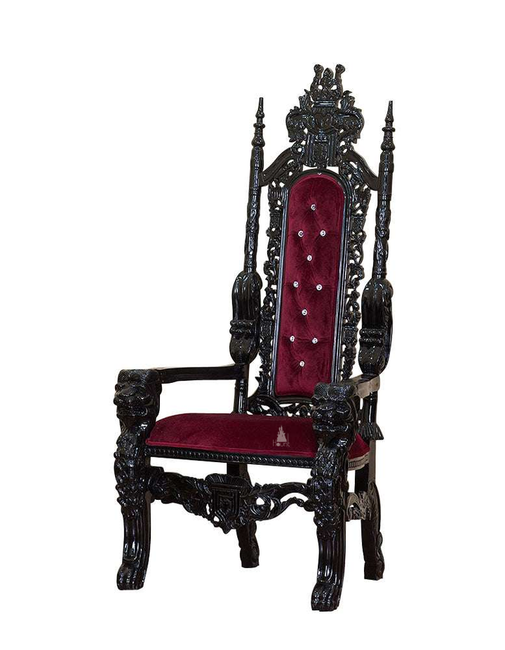 The Emperor Throne, a handcrafted gothic throne chair with a tall openwork back, crown-like cresting and upholstered back and seat panels.