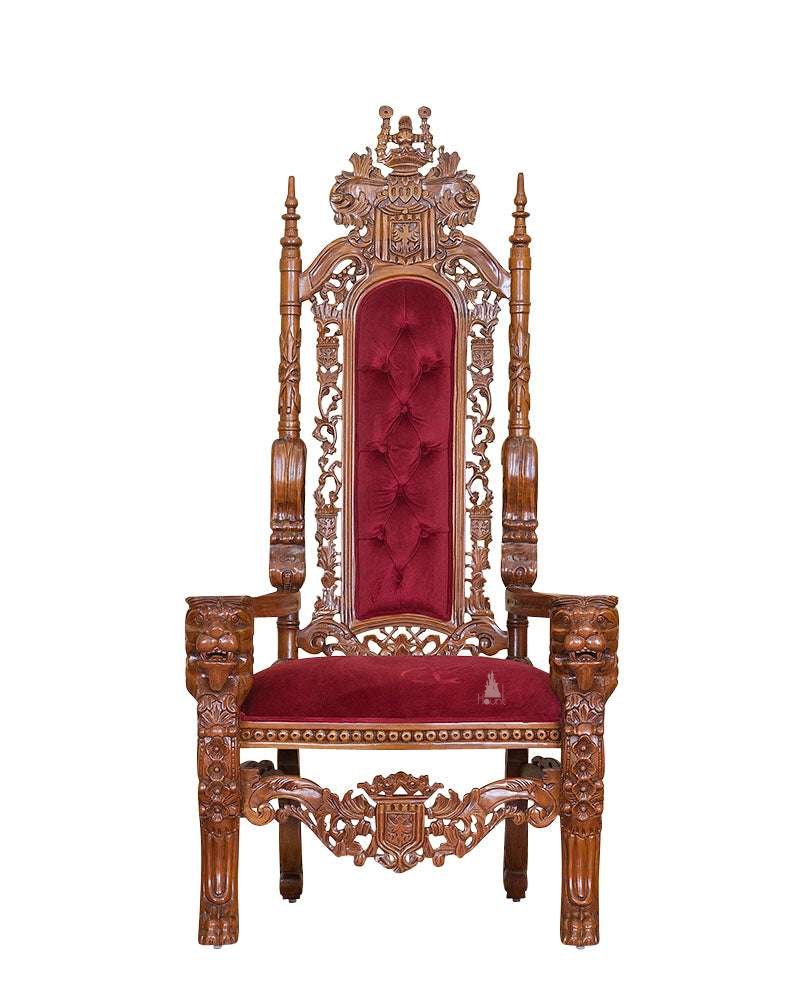 The Emperor Throne, a handcrafted gothic throne chair with a tall openwork back, crown-like cresting and upholstered back and seat panels.