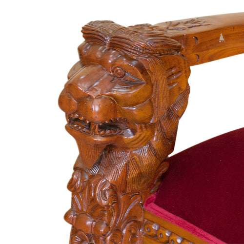 The Emperor Throne, a handcrafted gothic throne chair with a tall openwork back, crown-like cresting and upholstered back and seat panels.