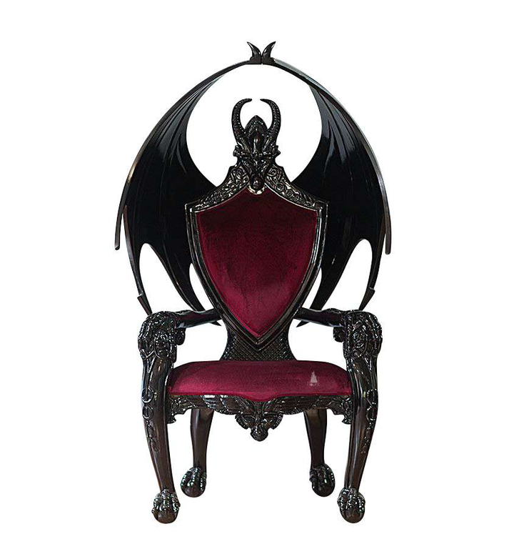 The House of Fire Throne, a handcrafted gothic throne chair with a bat-wing frame, horned carved crest and shield-shaped upholstered back.