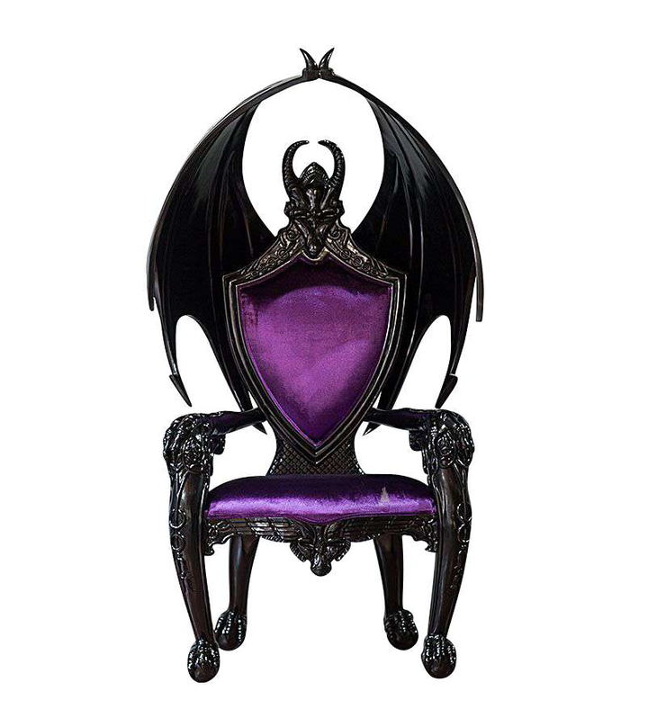 The House of Fire Throne, a handcrafted gothic throne chair with a bat-wing frame, horned carved crest and shield-shaped upholstered back.
