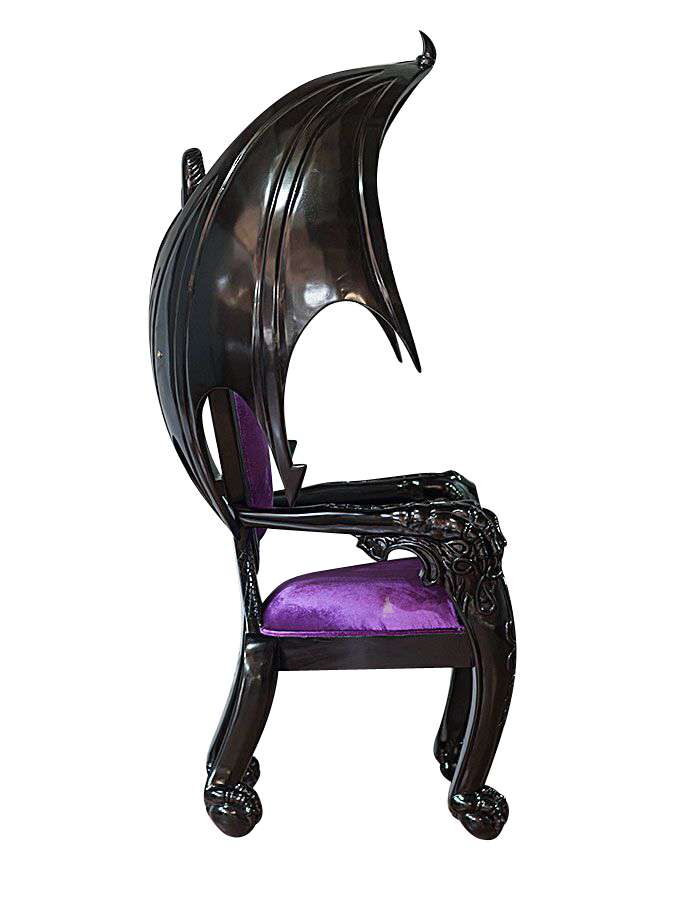 The House of Fire Throne, a handcrafted gothic throne chair with a bat-wing frame, horned carved crest and shield-shaped upholstered back.