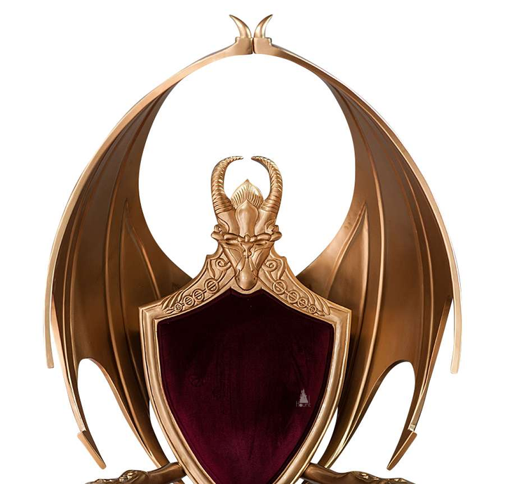 The House of Fire Throne, a handcrafted gothic throne chair with a bat-wing frame, horned carved crest and shield-shaped upholstered back.