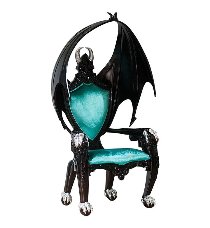 The House of Fire Throne, a handcrafted gothic throne chair with a bat-wing frame, horned carved crest and shield-shaped upholstered back.