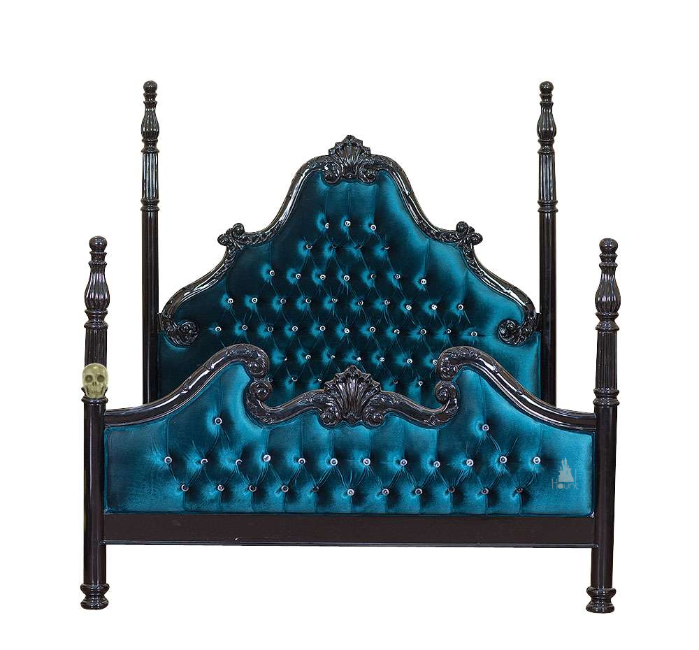Luxe Bed shown with button-tufted upholstery framed by dark hand-carved mahogany