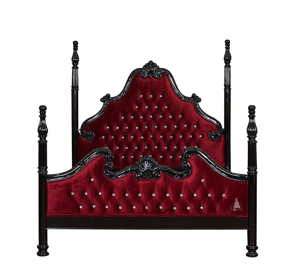 Luxe Bed shown with button-tufted upholstery, carved frame and tall four poster posts