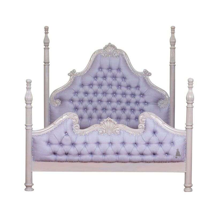 Luxe Bed styled in a dark luxury bedroom with tall posts, carved frame and upholstered panels