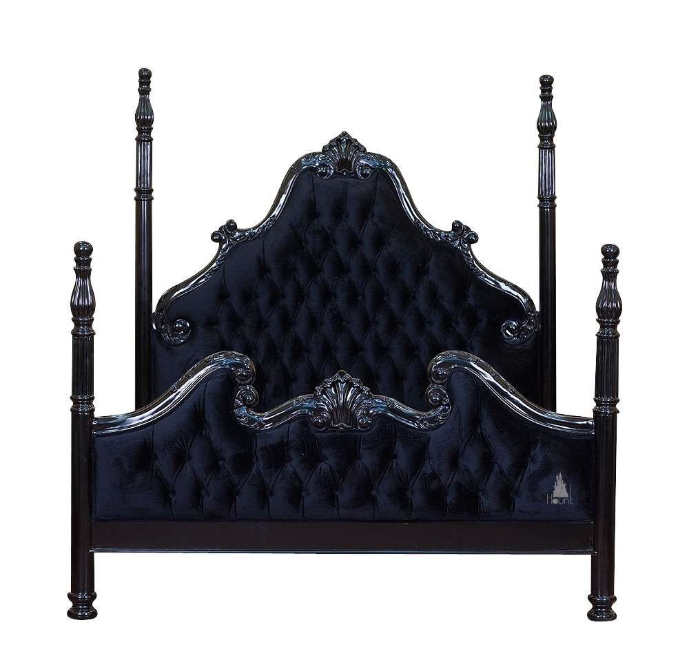 Detail view of the Luxe Bed showing carved mahogany frame and upholstered panel construction