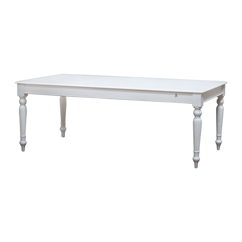 The Luxe Dining Table, a handcrafted rectangular dining table with a clean top, straight apron and turned legs.