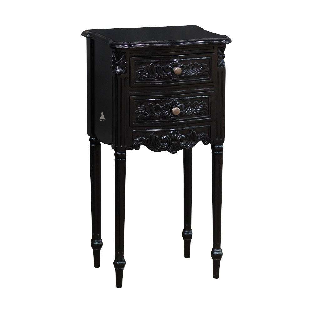 The Luxe Side Table, a handcrafted black side table with two drawers, carved drawer fronts and tall slender legs.