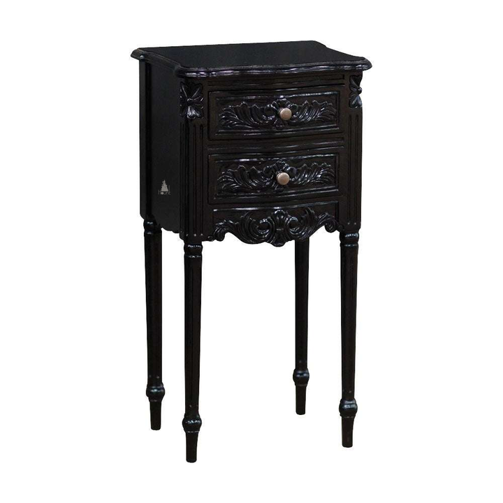The Luxe Side Table, a handcrafted black side table with two drawers, carved drawer fronts and tall slender legs.