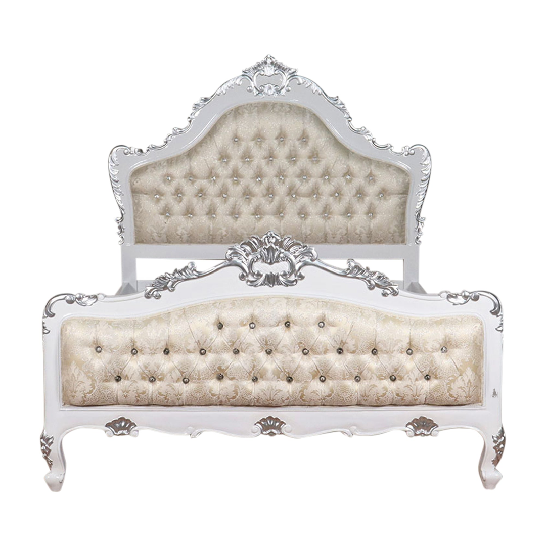 The Mafia Bed, a handcrafted upholstered statement bed with deep button tufting, serpentine lines and carved crest detailing.