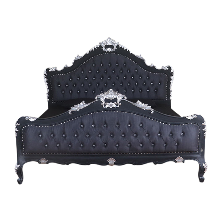 The Mafia Bed, a handcrafted upholstered statement bed with deep button tufting, serpentine lines and carved crest detailing.