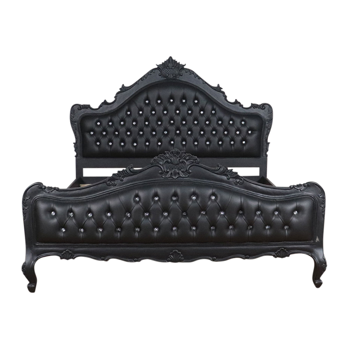 The Mafia Bed, a handcrafted upholstered statement bed with deep button tufting, serpentine lines and carved crest detailing.