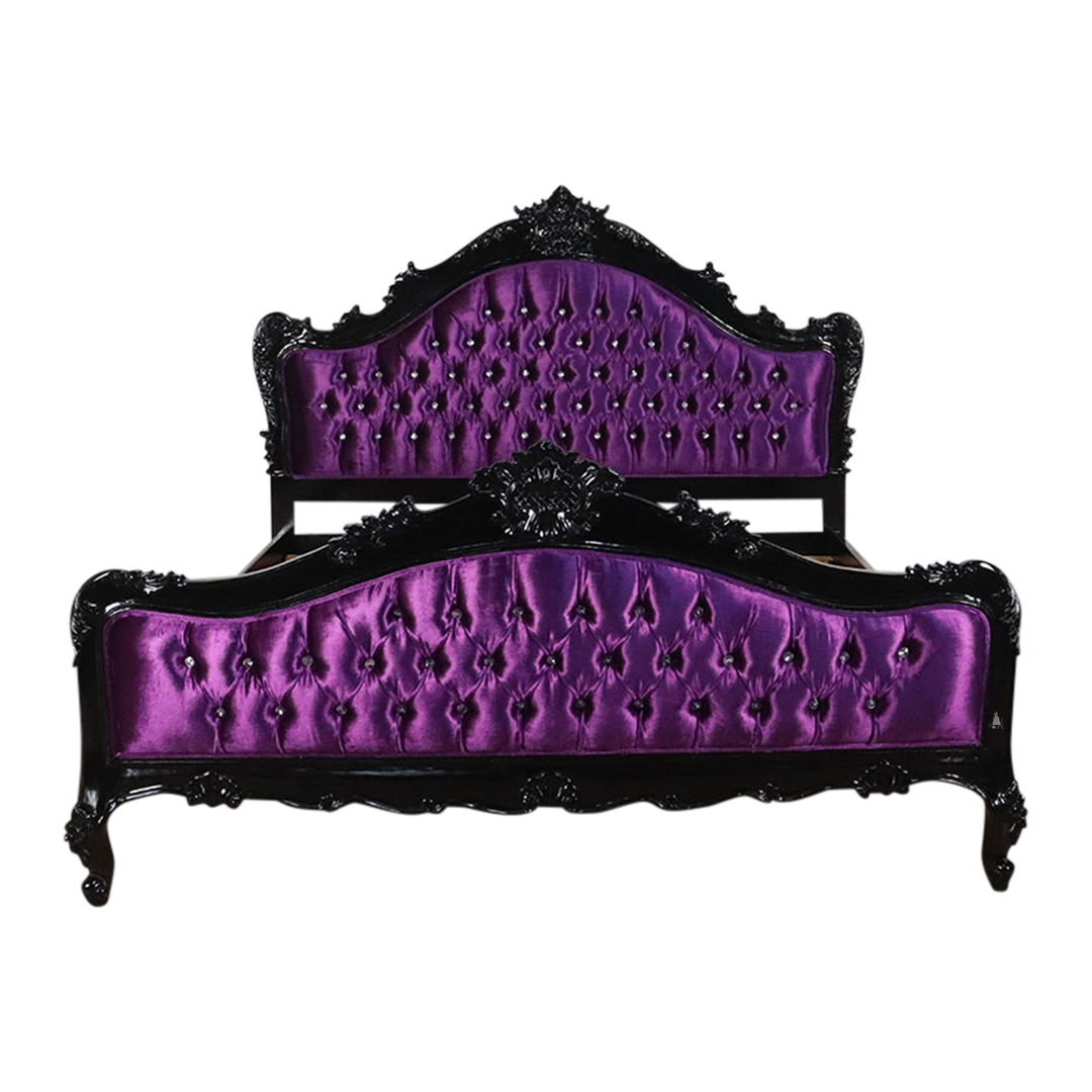 The Mafia Bed, a handcrafted upholstered statement bed with deep button tufting, serpentine lines and carved crest detailing.
