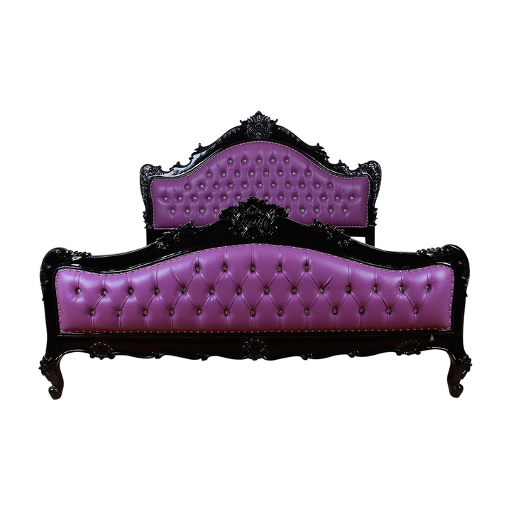 The Mafia Bed, a handcrafted upholstered statement bed with deep button tufting, serpentine lines and carved crest detailing.