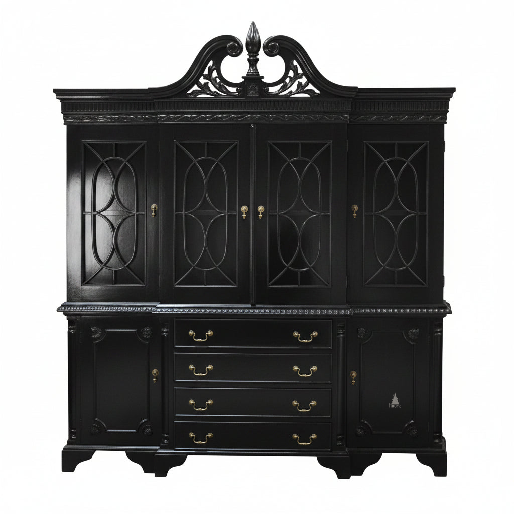 The Maleficent Bookcase, a handcrafted timber bookcase with glazed upper doors, central drawers, lower cupboards and a shaped pediment.