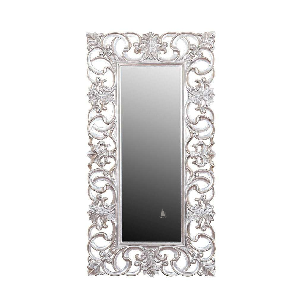 Another view of the Nymph Mirror, a tall rectangular mirror surrounded by open carved scrollwork