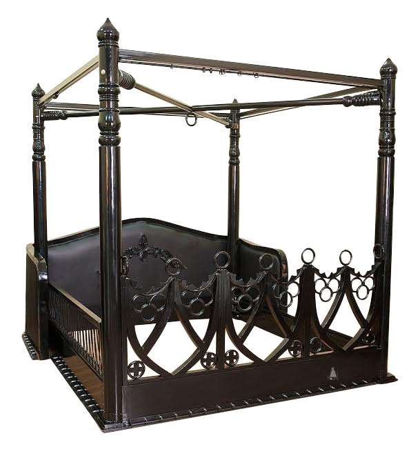 The Obey Surrender BDSM Bed, a handcrafted BDSM-inspired four poster bed with metal frame, O-ring hardware and open restraint-inspired panels.