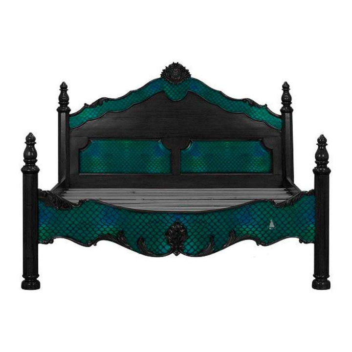 Odyssey Bed shown with teal upholstered inlay framed by dark carved timber