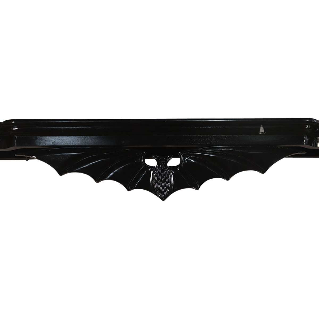 Another view of the Queen of the Damned Bed Crown, a glossy black wall-mounted bed crown with a carved bat-wing form
