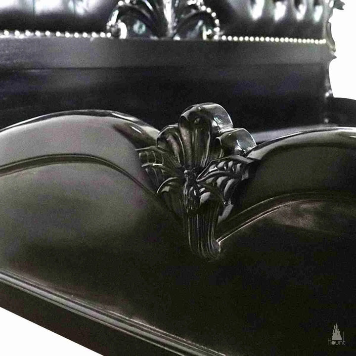 Closeup of the sideboards of the Queen of the Damned bed