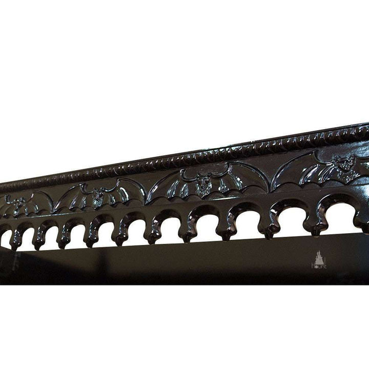 Close-up of the Queen of the Damned Cathedral Bed showing ornate top carving, gothic tracery and hand-finished mahogany detail