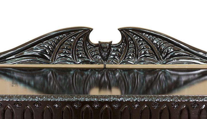 Another view of the Queen of the Damned Cathedral Dresser, a black chest of drawers crowned with a carved bat-wing crest