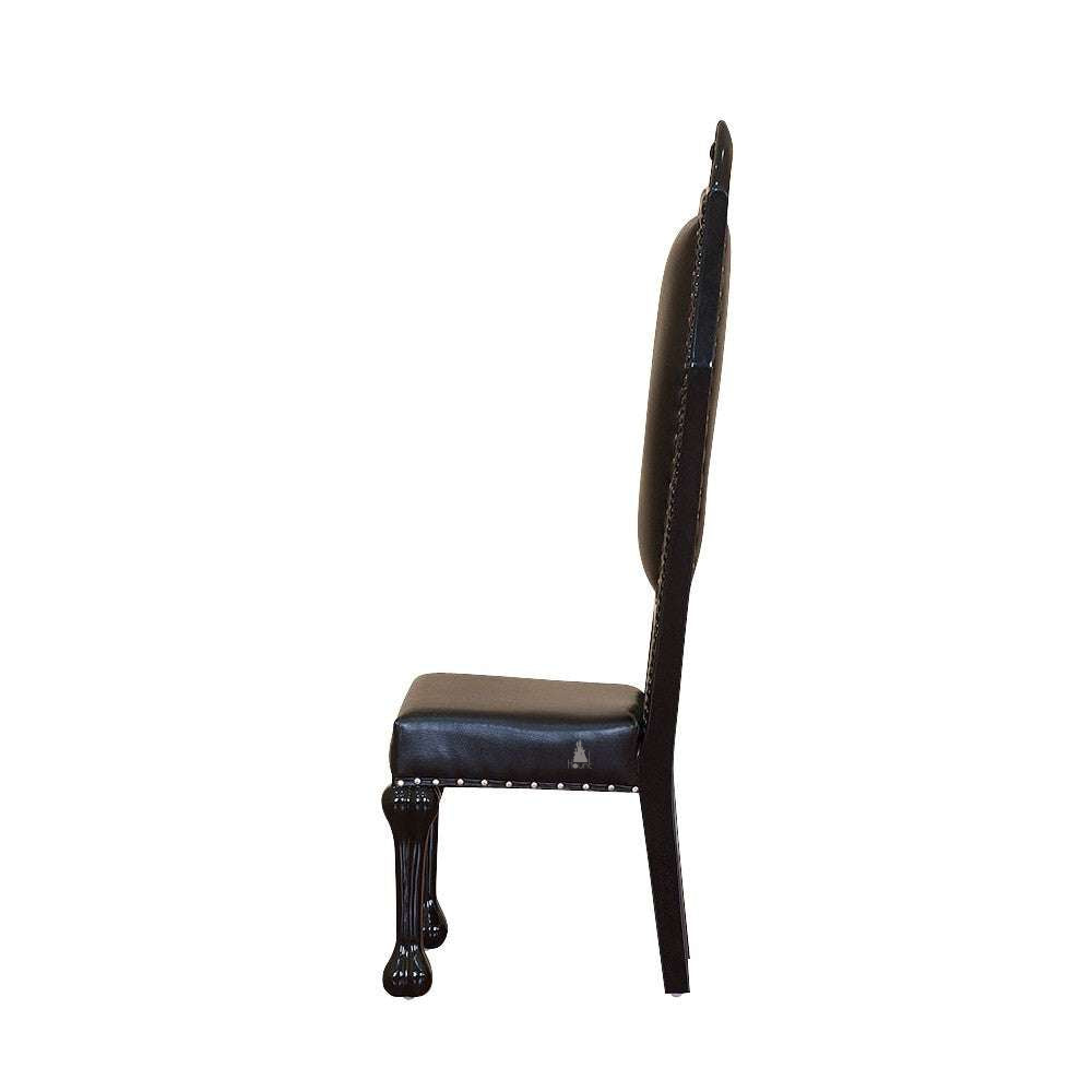 Another view of the Queen of the Damned Chair, a tall gothic dining chair with a coffin-like back shape